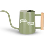 Sage green watering can with wooden handle and white Grow with the Flow text surrounded by leaf graphics perfect calming gift for plant lovers and self-care moments