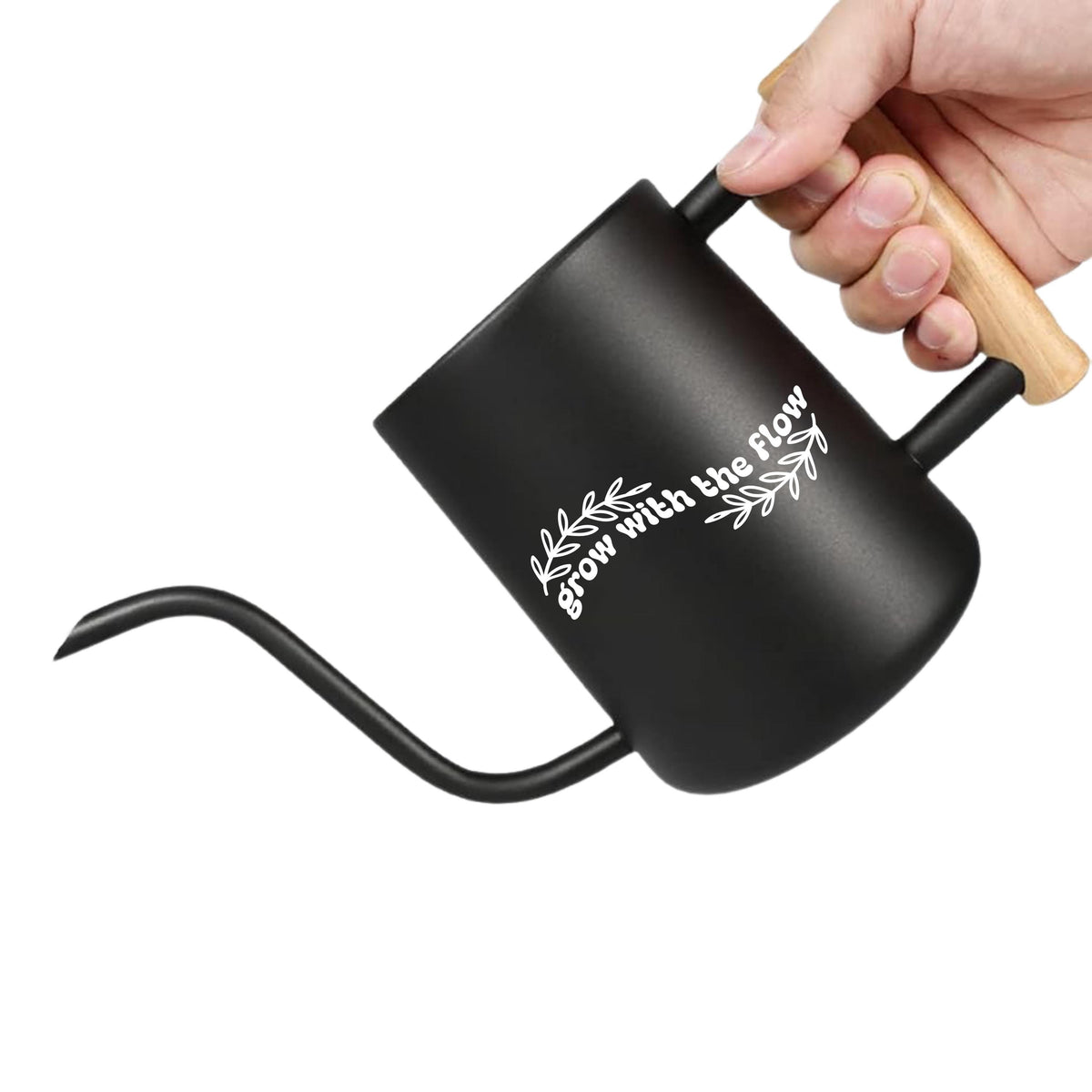 Black watering can with a wooden handle. The watering can has a long spout and a white inscription that reads 'Grow with the flow'.