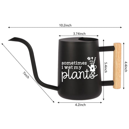 Black watering can with a wooden handle. The can has a spout and a white inscription that reads 'sometimes i wet my plants'. The can is 10.2 inches tall, 4.2 inches wide, and 5.4 inches deep.