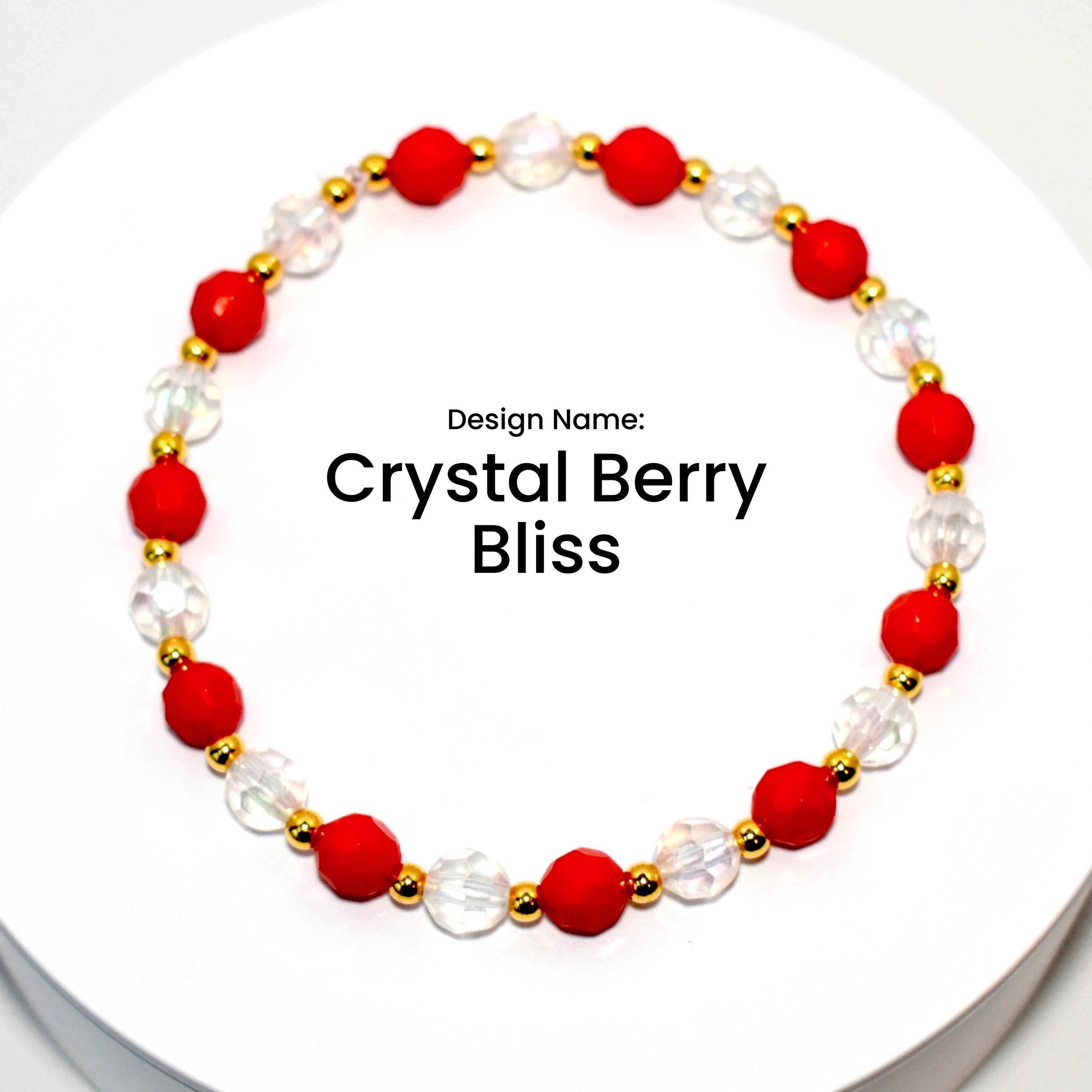 A red and clear crystal bracelet with gold beads. The bracelet is on a white background. The text 'Design Name: Crystal Berry Bliss' is printed below the bracelet.