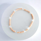 Orange and Gold Bracelet Stack with Pearl and Clear Bead Accents