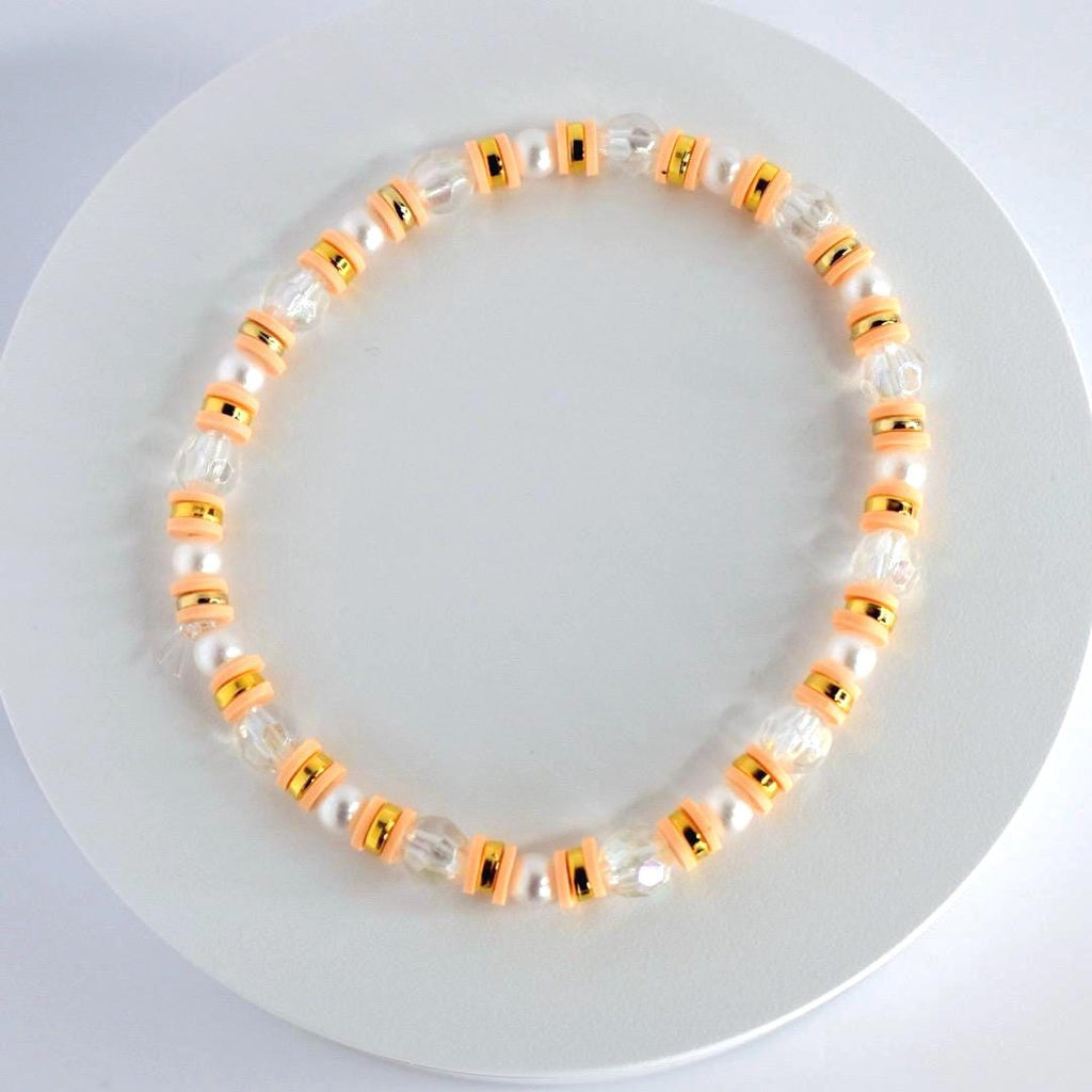 Orange and Gold Bracelet Stack with Pearl and Clear Bead Accents