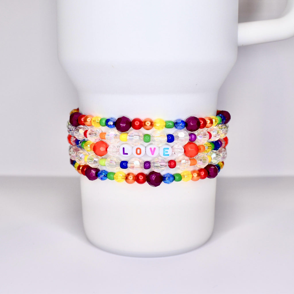 Rainbow Pride Tumbler Jewelry CollectionBeaded Bracelet DesignLetter Charm AccessoryElastic Band SystemBottle Identity MarkerClear Crystal DetailsUniversal Cup CompatibilityPersonalized Style StatementModern Gift IdeaDrink Holder Essential