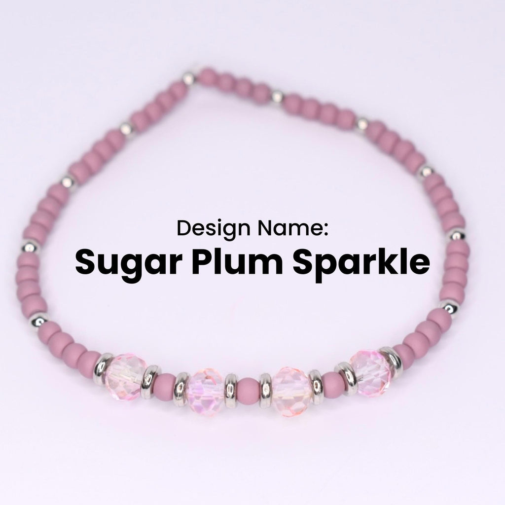 A Sugar Plum Sparkle bracelet. The bracelet features small, round, matte mauve beads interspersed with silver-colored metal beads. The bracelet also has larger, faceted, clear beads with a pinkish hue, adding a touch of sparkle. The design name is displayed in black text.