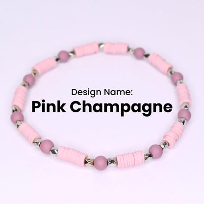 Pink Champagne beaded bracelet. The bracelet features light pink, disc-shaped beads interspersed with small, round, mauve-colored beads. Silver-colored metal beads are between the disc beads. The design name 'Pink Champagne' is displayed in black text.