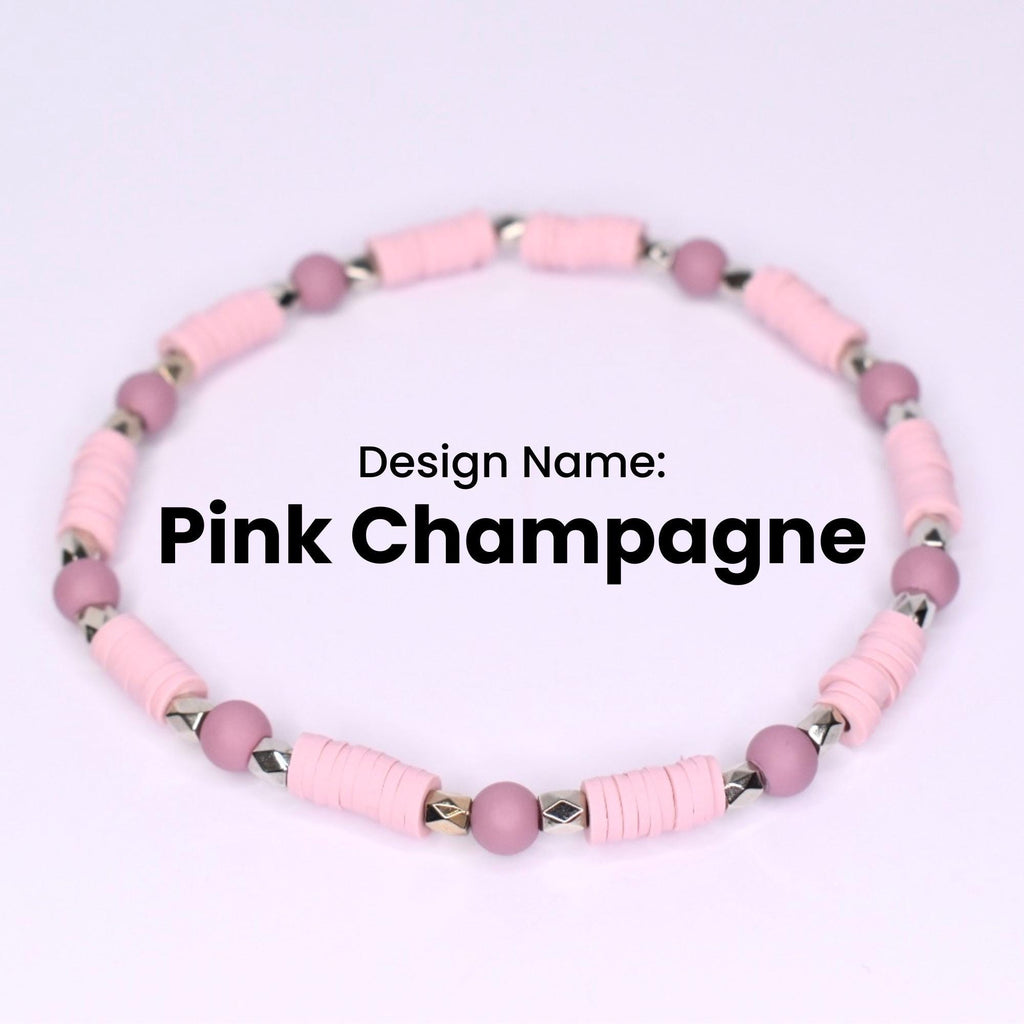 Pink Champagne beaded bracelet. The bracelet features light pink, disc-shaped beads interspersed with small, round, mauve-colored beads. Silver-colored metal beads are between the disc beads. The design name 'Pink Champagne' is displayed in black text.
