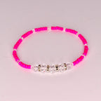 Tropical tumbler bracelet set of 5 with monstera leaves, sparkly green beads, and pink hibiscus flowers—perfect for beach vacations and poolside flair.