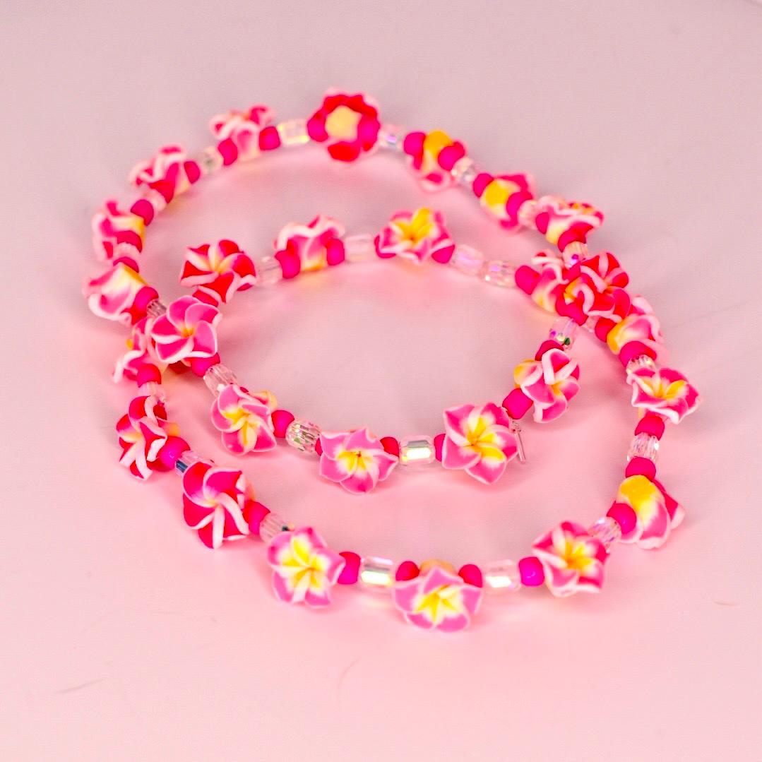 Vibrant tumbler bracelet stack featuring palm leaf charms and floral accents—bring the island vibe to your vacation tumbler decor with this fun, handmade set.