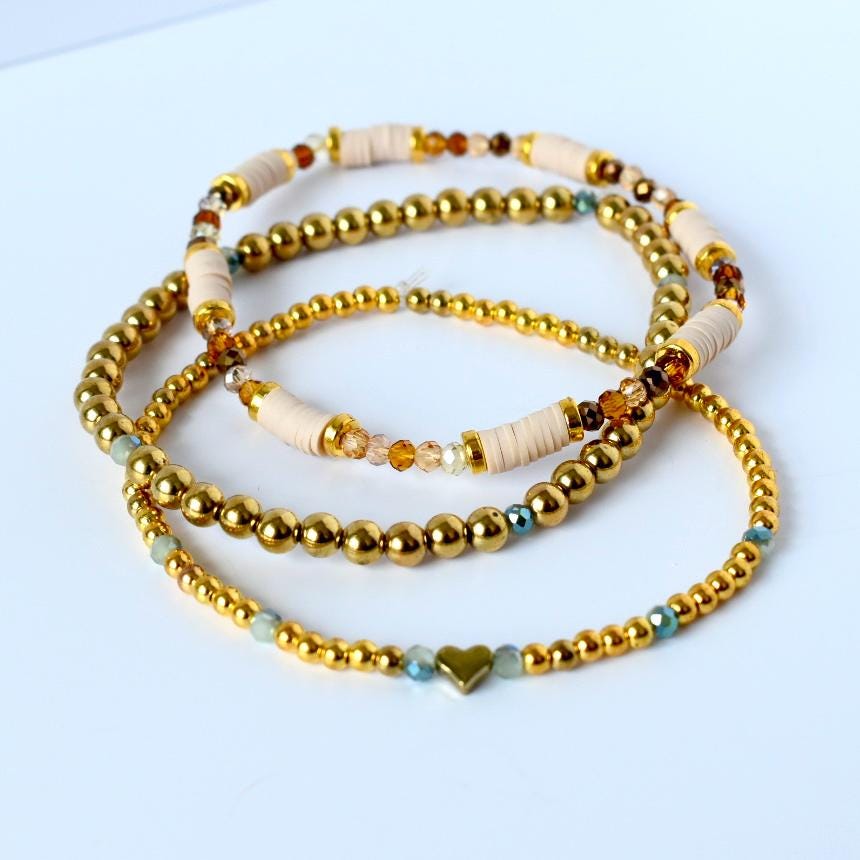 Minimalist tumbler bracelet stack of 3 in soft blush and sage with gold highlights—handcrafted for neutral tumblers and lovers of modern, elegant detail.