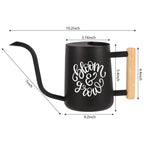 Black metal watering can with a wooden handle and the words "bloom & grow" in white script. The can is 10.2 inches long, 4.2 inches wide, and 5.4 inches tall. The spout is 7 inches long.