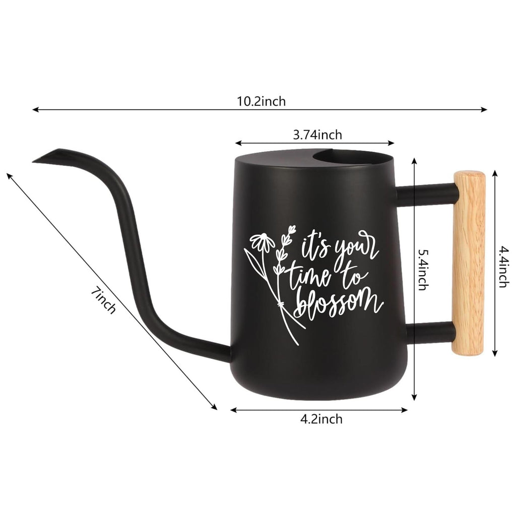 A black watering can with a long, curved spout and a wooden handle. The watering can has white text that reads 'it's your time to blossom' with a floral design. Dimensions are labeled: 10.2inch, 7inch, 4.2inch, 3.74inch, 5.4inch, and 4.4inch.