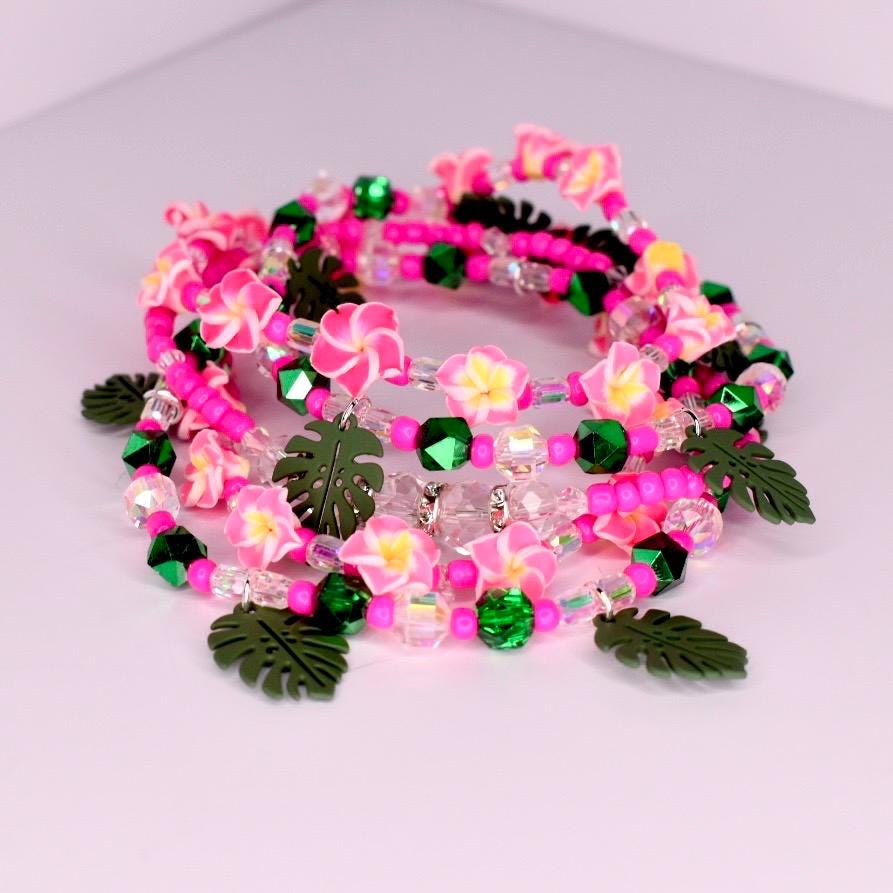 Set of 5 floral tumbler bracelets in green and pink with pearl and sparkle details—an ideal handmade gift for her, great for tropical gift baskets or summer events.