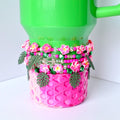 Stack of 5 handmade tumbler bracelets featuring pink flowers, sparkly green beads, pearl accents, and green monstera leaves—perfect tropical tumbler decor for summer vibes.