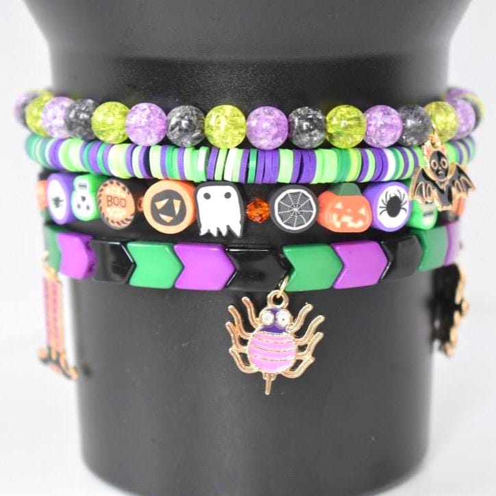 Halloween Tumbler Bracelet Stack Metal Charm Collection Stretch Band Set Orange Black Tumbler Accessory Holiday Drink Cup Design Perfect Party Essential Spooky Style Accent Beautiful Display Collection Seasonal Gift Idea Festive Addition
