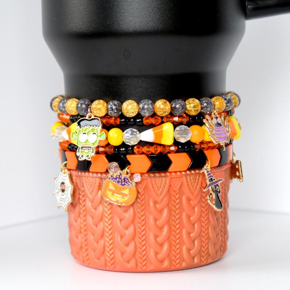 Halloween Tumbler Bracelet Set Orange Black Theme Drink Cup Accessory Collection Metal Charm Stretch Holiday Gift Spooky Style Design Perfect Party Festive Drink Holder Decoration Seasonal Halloween Tumbler Bracelet Charm Set Fall Decoration Drink Accessory Orange Black Metal Charm Stretch Band Tumbler Decor Spooky Accent Halloween Gift Drink Cup Holder Decoration Drink Accessory Tumbler Stack Charm Collection Fall Theme Orange Black Drink Decor Spooky Charm Halloween Gift Cup Tumbler Bracelet