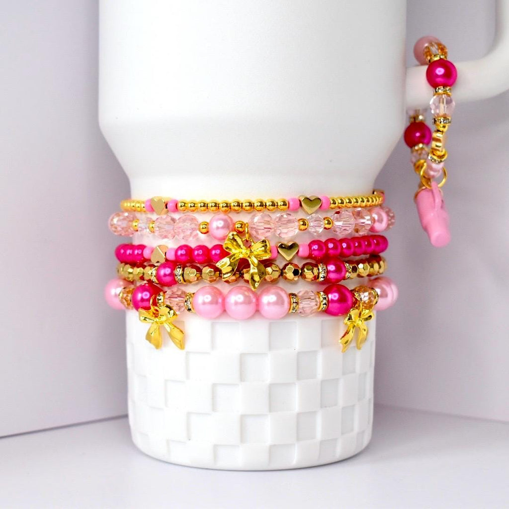 Pink tumbler charm bracelet with tiny pink tumbler charm, gold bows, pearls, and sparkling pink beads fun girly cup accessory.
