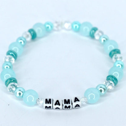 Mama bracelet with green and white pearl beads, crystal accents, and letter beads spelling MAMA handmade mom jewelry gift.