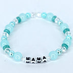 Mama bracelet with green and white pearl beads, crystal accents, and letter beads spelling MAMA handmade mom jewelry gift.