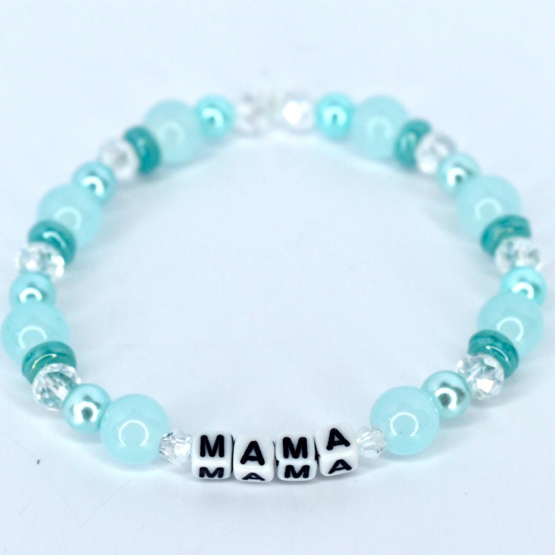Mama bracelet with green and white pearl beads, crystal accents, and letter beads spelling MAMA handmade mom jewelry gift.