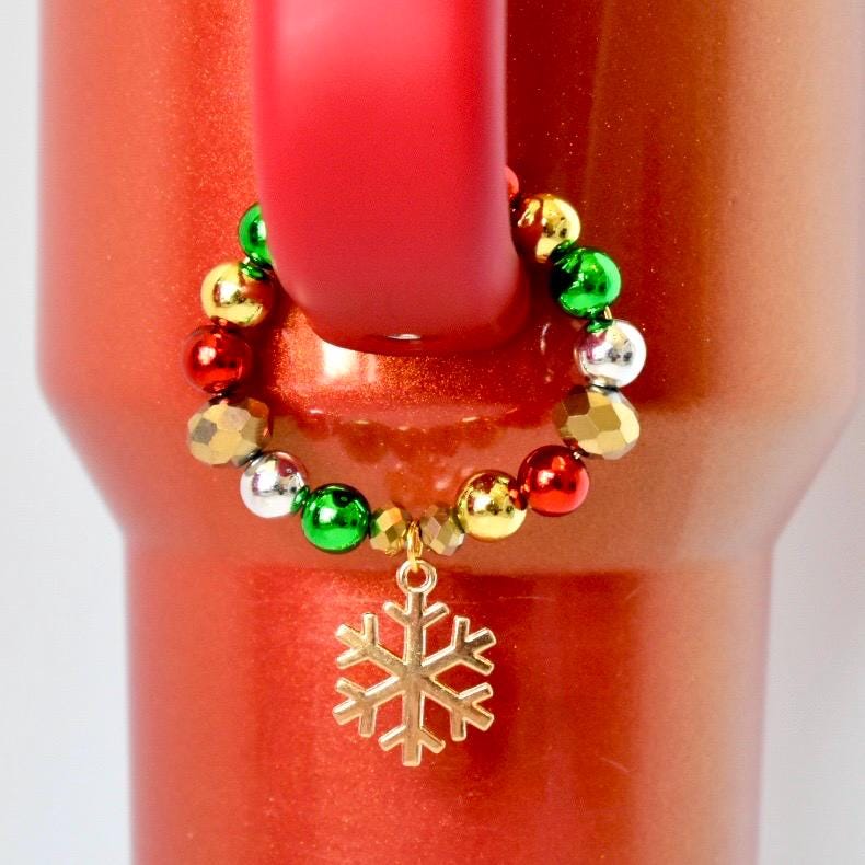Christmas tumbler handle bracelet with red, green, gold, and silver beaded design and gold snowflake charm