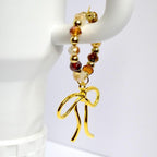 Chocolate Brown and Gold Tumbler Handle Bracelet with Amber Beads, Bow Charms