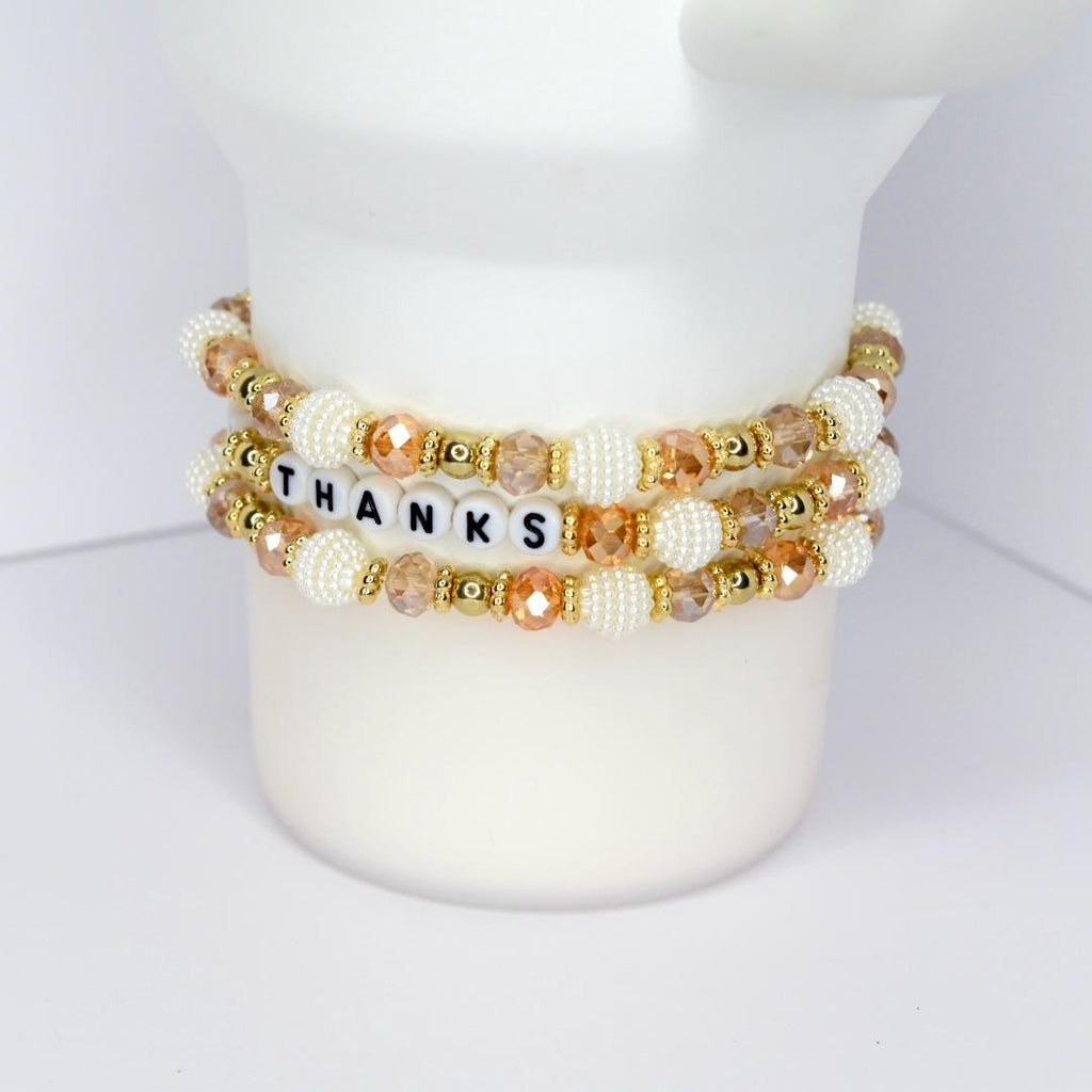 Fall tumbler bracelet with gold, white, and crystal beads – ‘Give Thanks’ beaded wrap for autumn drinkware and Thanksgiving gifts.