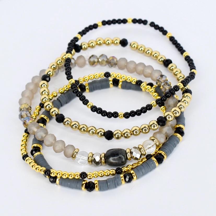 Modern tumbler bracelet wrap – sleek black, gray, and gold beaded drink accessory.