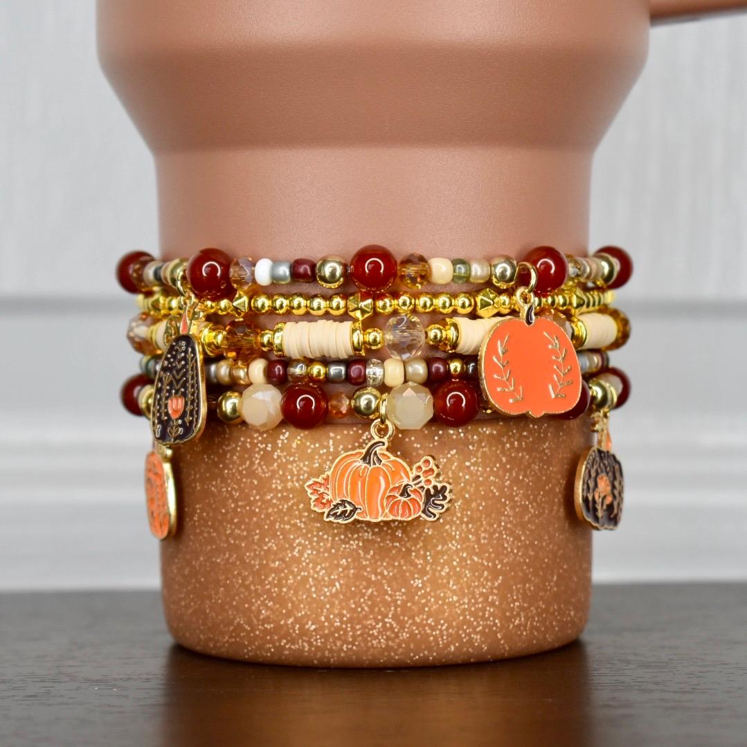 Harvest Stanley bracelet stack for fall with pumpkin charms in autumn colors.