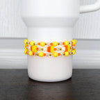 Candy corn bracelet – festive orange, yellow, and white beaded wrap for Halloween tumblers or wrist jewelry.