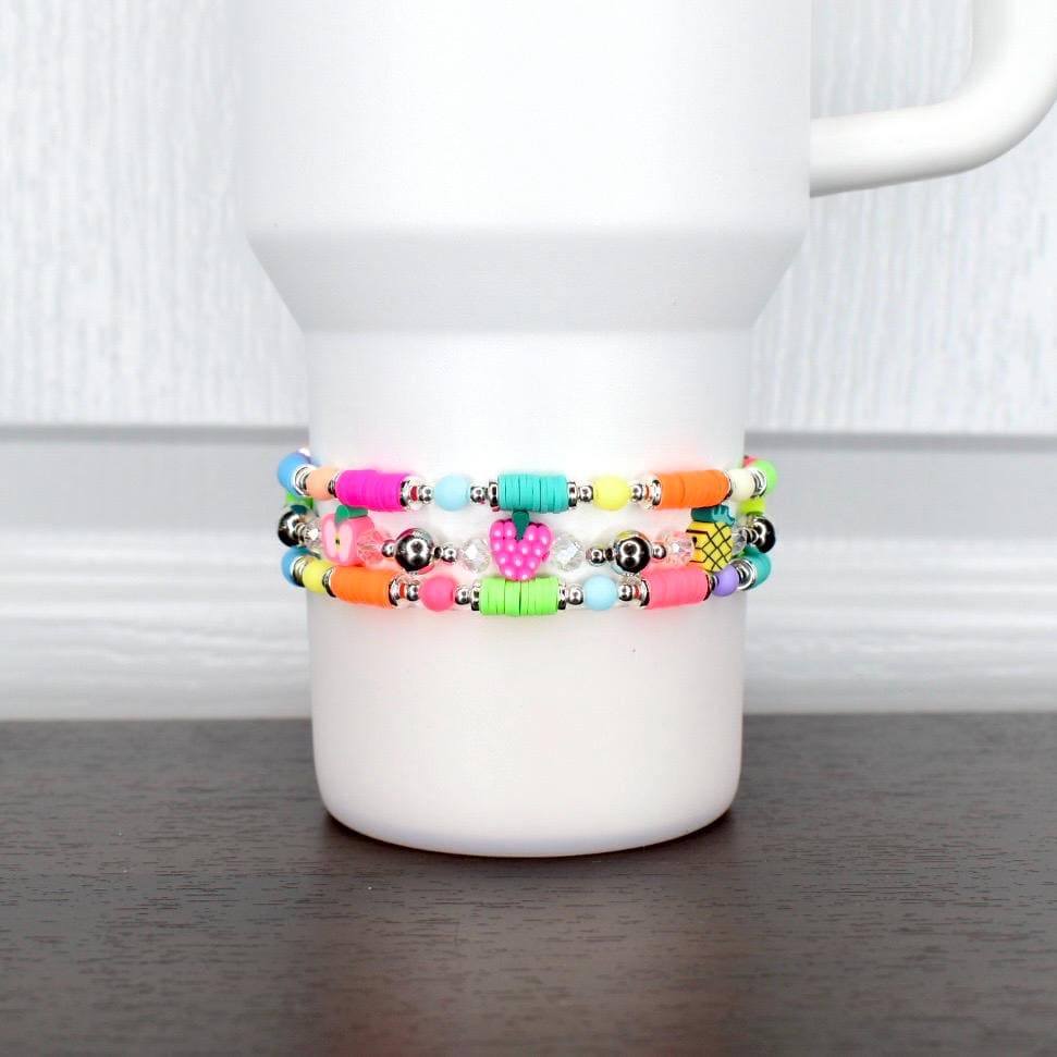 Summer fruit bracelet – neon beaded wrap with colorful fruit charms, wearable as tumbler accessory or fun wrist jewelry.