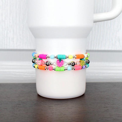 Summer fruit bracelet – neon beaded wrap with colorful fruit charms, wearable as tumbler accessory or fun wrist jewelry.