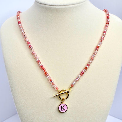 Glass Bead Necklace Jewelry Beaded Strand Pink Red White Colors Gold Hardware Toggle Clasp Initial Pendant Custom Monogram Charm Accent Handmade Jewelry Collection Personalized Gift Idea