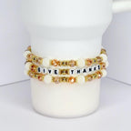 Thanksgiving tumbler bracelet with gold and white beads – ‘Give Thanks’ beaded wrap for fall drinkware accessories.