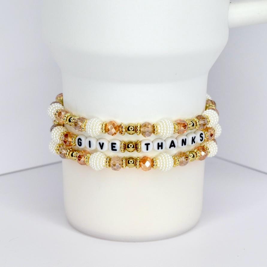 Thanksgiving tumbler bracelet with gold and white beads – ‘Give Thanks’ beaded wrap for fall drinkware accessories.