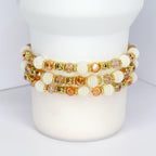 Thanksgiving beaded tumbler bracelet – autumn-inspired wrap with gold accents and ‘Give Thanks’ lettering.