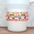 Five layered beaded bracelets for tumbler or wrist, designed with pink pearls, gold stars, and faceted clear beads.