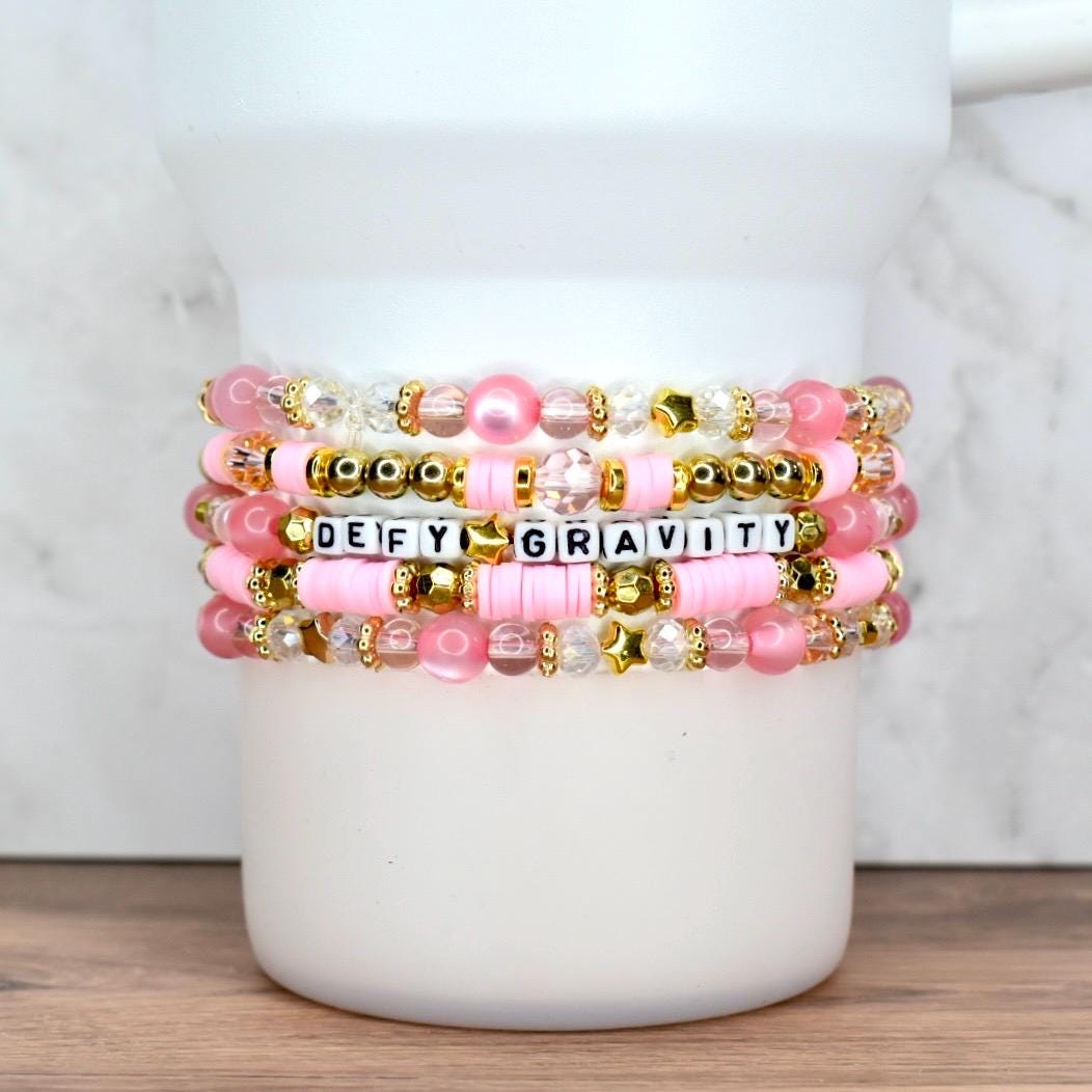 Five layered beaded bracelets for tumbler or wrist, designed with pink pearls, gold stars, and faceted clear beads.