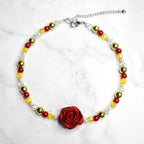 Belle inspired necklace for kids with red rose pendant, yellow glass beads, gold accent beads, and white pearls on marble background - Disney Beauty and the Beast costume jewelry