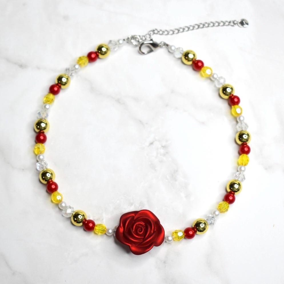 Belle inspired necklace for kids with red rose pendant, yellow glass beads, gold accent beads, and white pearls on marble background - Disney Beauty and the Beast costume jewelry