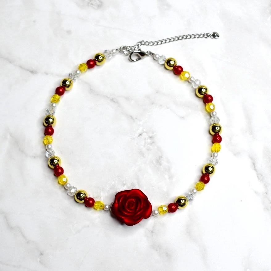Kids Belle costume necklace with red flower centerpiece, yellow crystal beads, gold metallic spheres, and white pearl details - Disney princess dress up jewelry