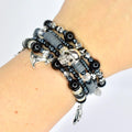 Gothic bracelet set – black and silver beaded wrap with spider, web, and skeleton hand charms for spooky goth accessories.