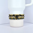 Beaded tumbler bracelet in black, gold, and gray – stylish cup wrap accessory for everyday use.