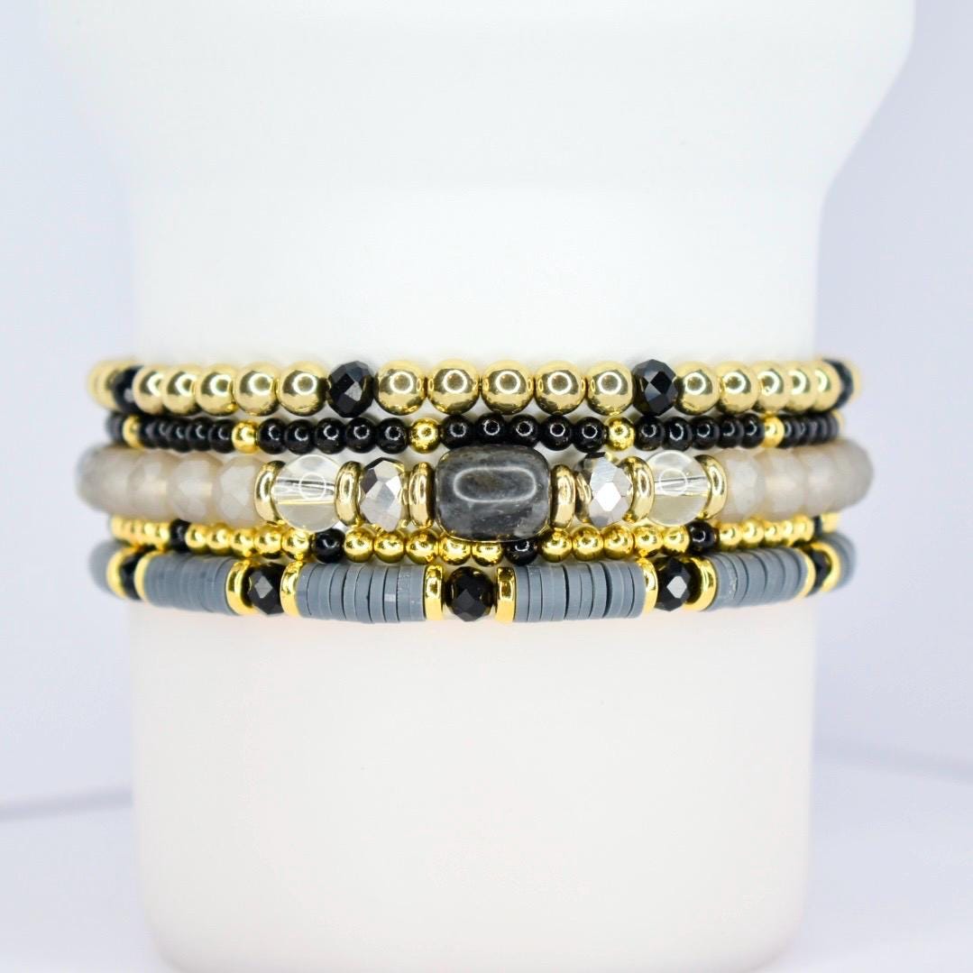 Reusable tumbler charm bracelet – chic black and gold beaded wrap for cups and drinkware.
