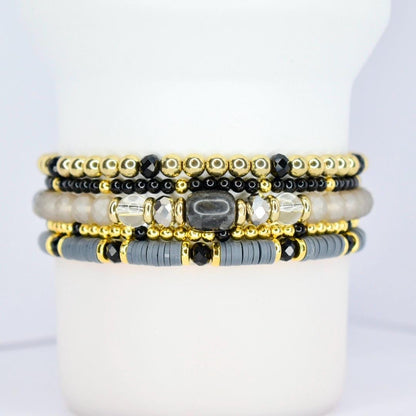 Reusable tumbler charm bracelet – chic black and gold beaded wrap for cups and drinkware.