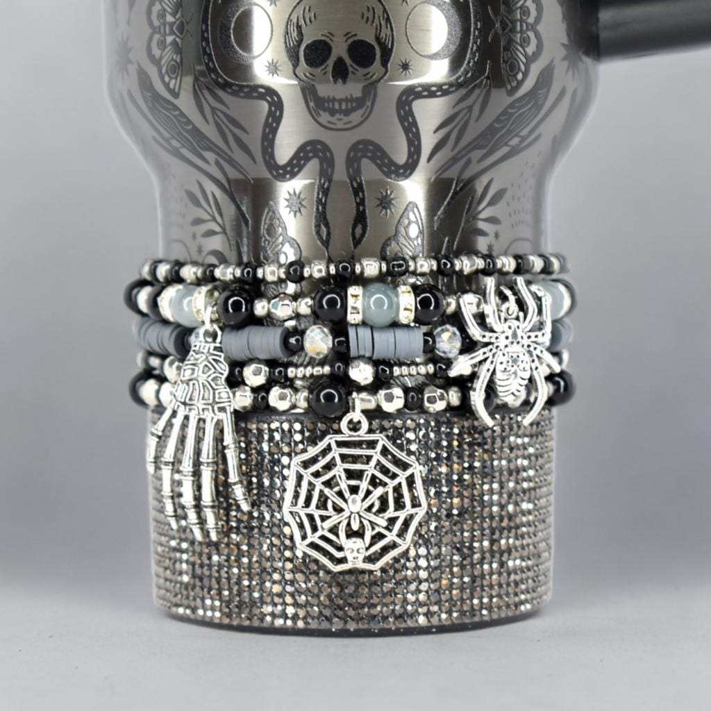 Halloween tumbler bracelet wrap with spider, skeleton hand, and spiderweb charms – gothic beaded drink accessory.