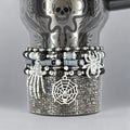 Halloween tumbler bracelet wrap with spider, skeleton hand, and spiderweb charms – gothic beaded drink accessory.