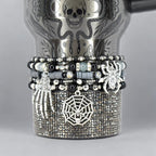 Halloween tumbler bracelet wrap with spider, skeleton hand, and spiderweb charms – gothic beaded drink accessory.