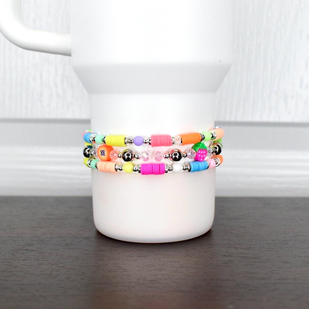 Colorful fruit tumbler bracelet – neon beads with strawberry and pineapple charms for fun summer cup accessories.