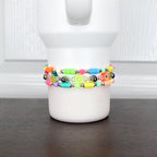 Bright fruity bracelet – neon beaded wrap with strawberry, pineapple, and apple charms, wearable on tumbler or wrist.