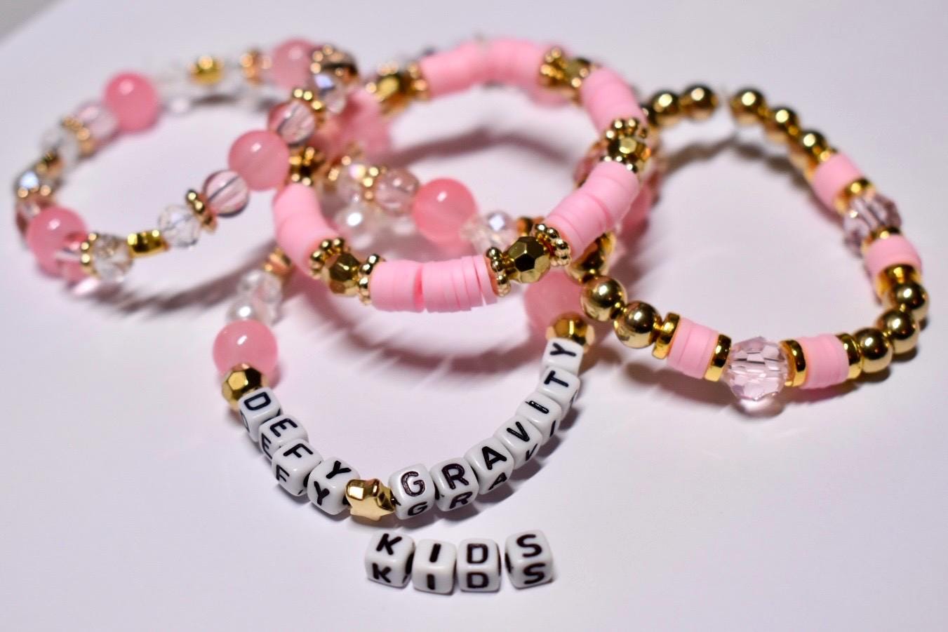 Defy Gravity Bracelet Collection: Pink and Gold Beaded Bracelets